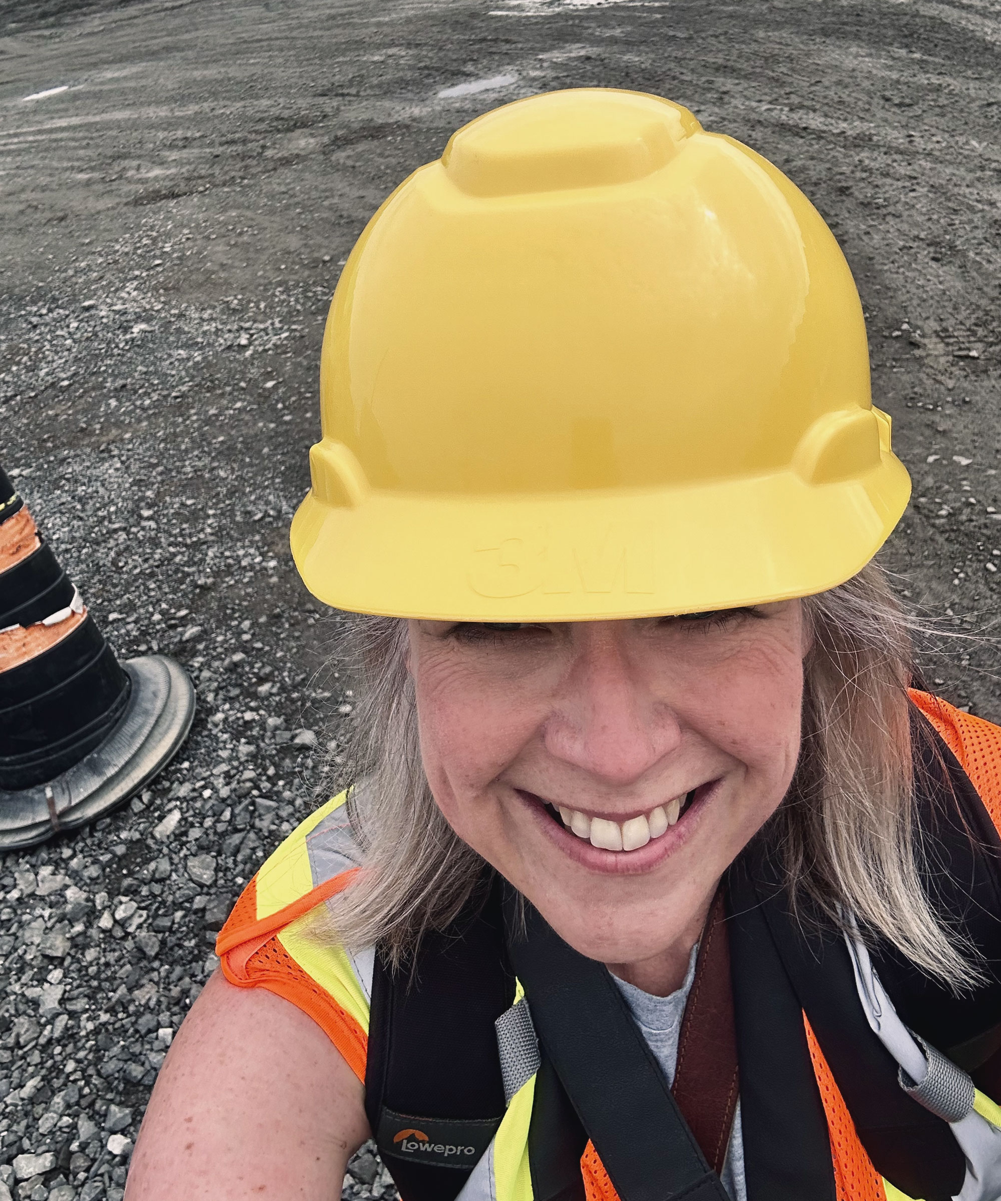 Di at a construction site, doing a photo shoot