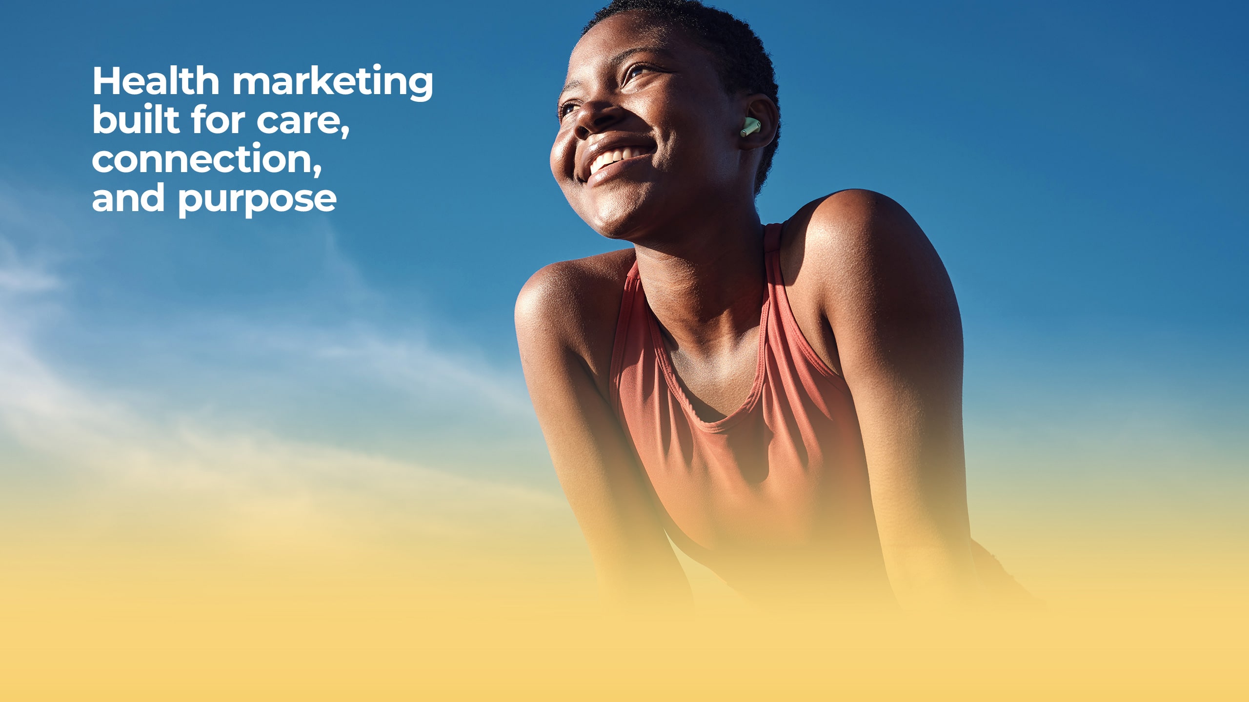 A woman smiles cheerfully and looks at the sky. Beside her is the caption 'Health marketing built for care, connection and purpose'